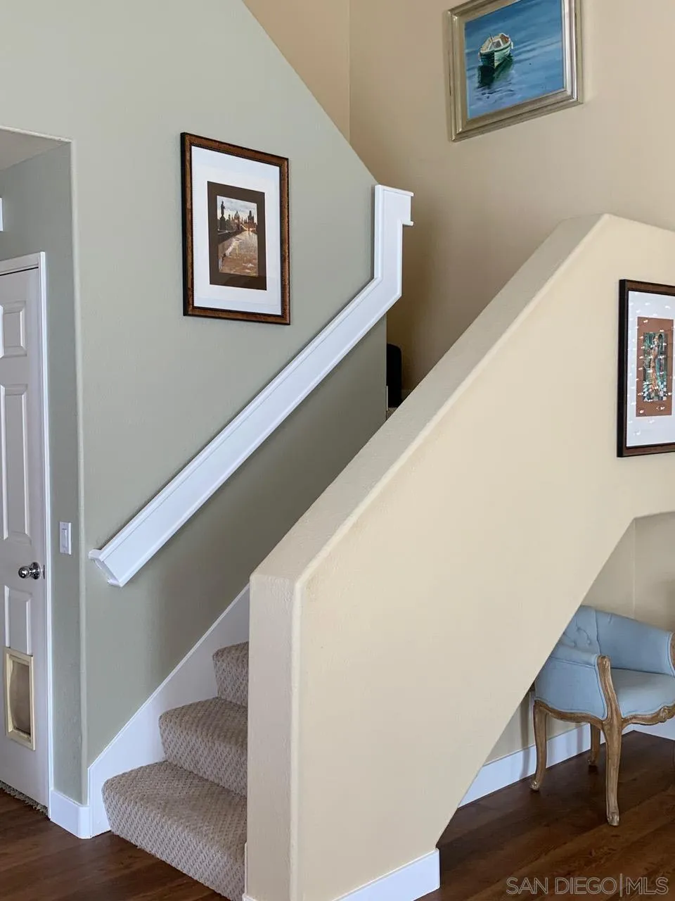 12602 Springbrook Drive, Unit B San Diego, CA 92128 - Photo 11 of 27 a view of hallway with stairs and wooden floor
