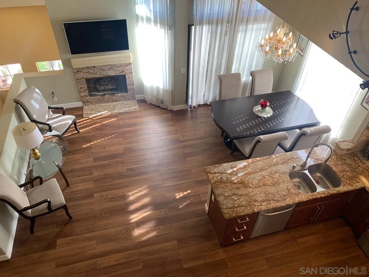12602 Springbrook Drive, Unit B San Diego, CA 92128 - Photo 15 of 27 a living room with furniture and a fireplace
