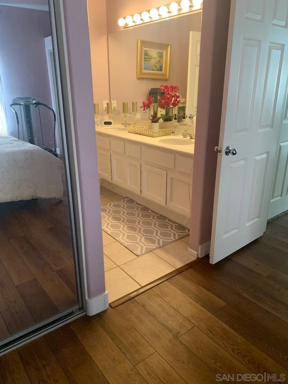 12602 Springbrook Drive, Unit B San Diego, CA 92128 - Photo 18 of 27 a bathroom with a sink and a mirror