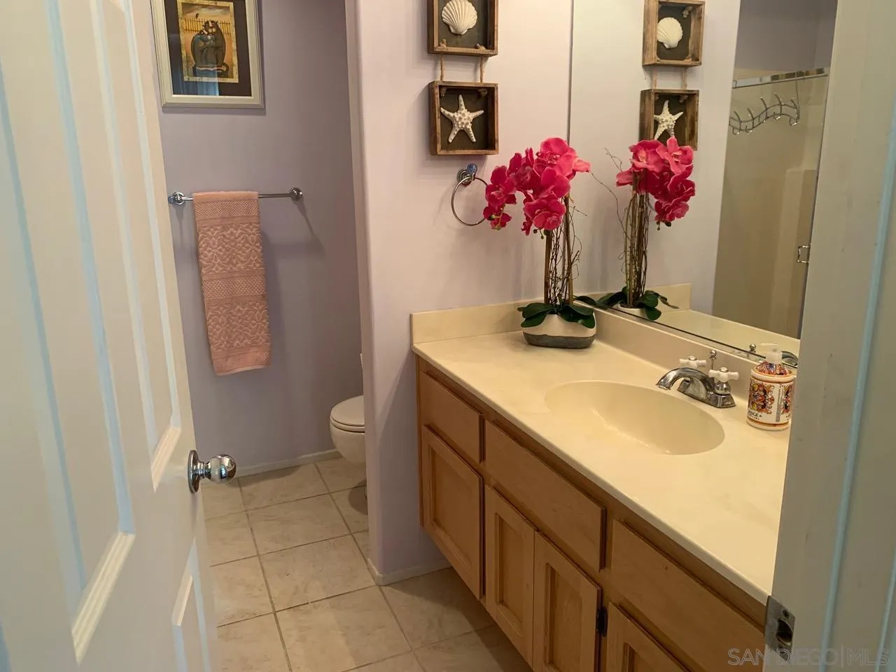 12602 Springbrook Drive, Unit B San Diego, CA 92128 - Photo 27 of 27 a bathroom with a sink vanity and mirror