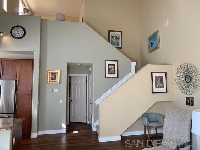 12602 Springbrook Drive, Unit B San Diego, CA 92128 - Photo 3 of 27 a view of a livingroom with furniture and wooden floor