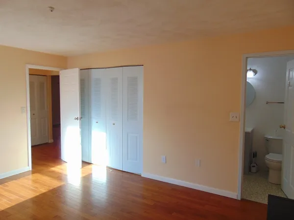 a bathroom with a sink mirror and toilet