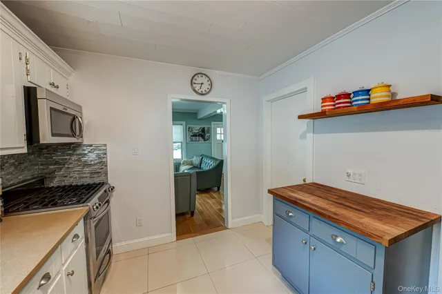 a kitchen with stainless steel appliances cabinets and a counter top space