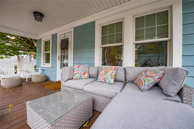 a outdoor living space with furniture and a large window