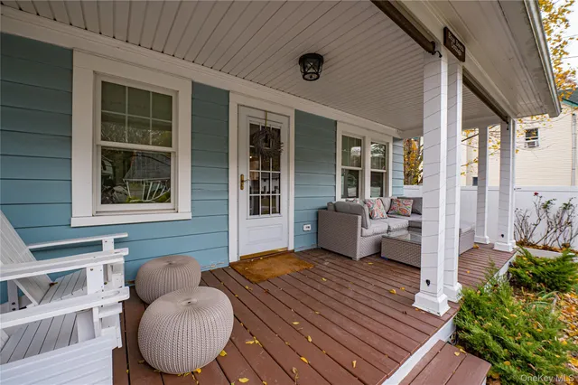 a balcony view with a seating space