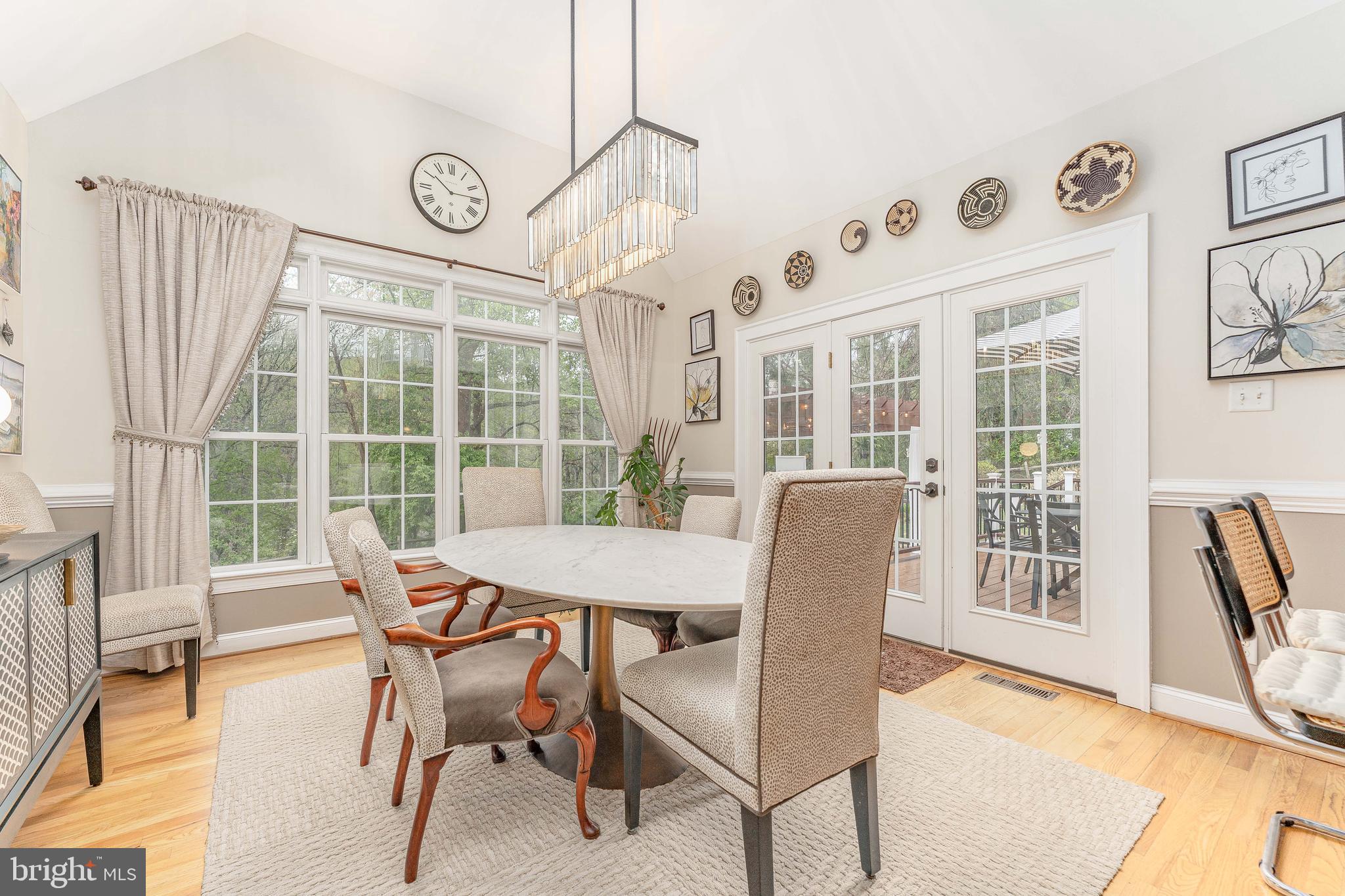 258 New Darlington Road Media, PA 19063 - Photo 26 of 120 a view of a dining room with furniture large windows and wooden floor