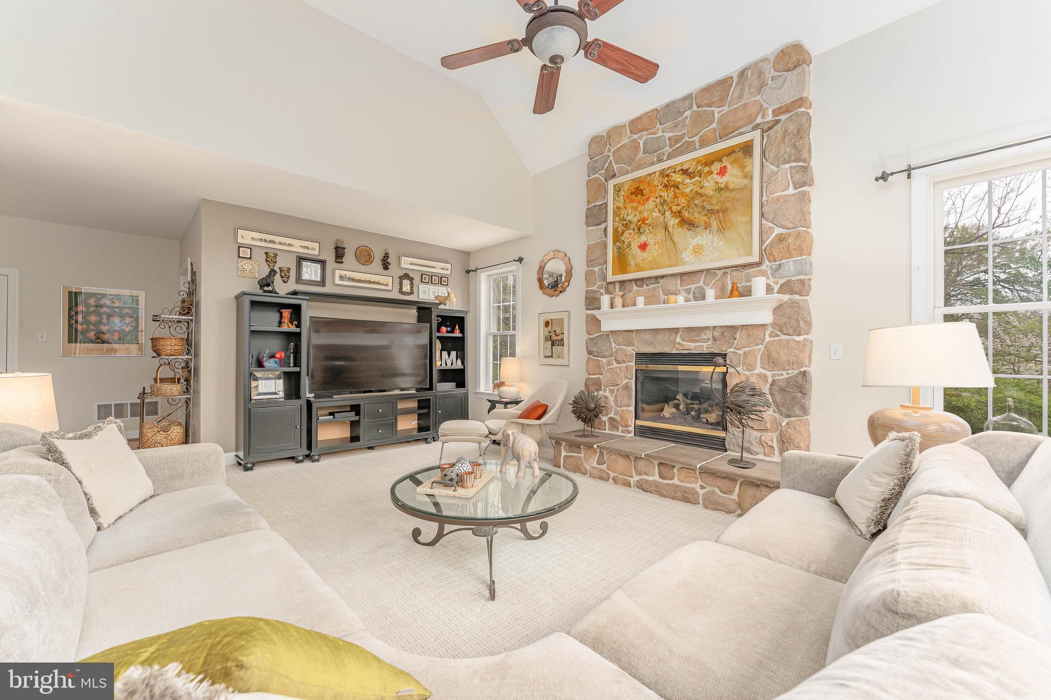 258 New Darlington Road Media, PA 19063 - Photo 36 of 120 a living room with furniture a flat screen tv and a fireplace