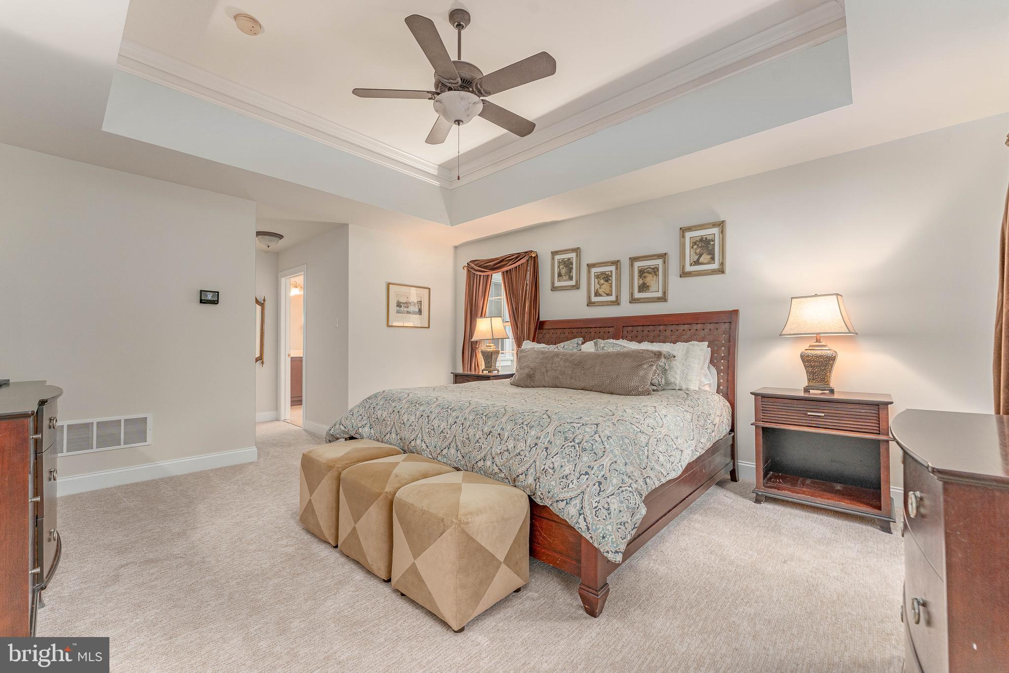 258 New Darlington Road Media, PA 19063 - Photo 43 of 120 a spacious bedroom with a bed and a chandelier