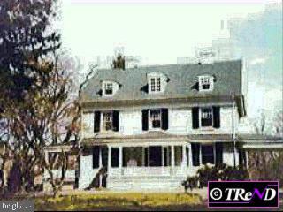 217 Conestoga Road Devon, PA 19333 - Photo 1 of 1 a front view of a building with a yard