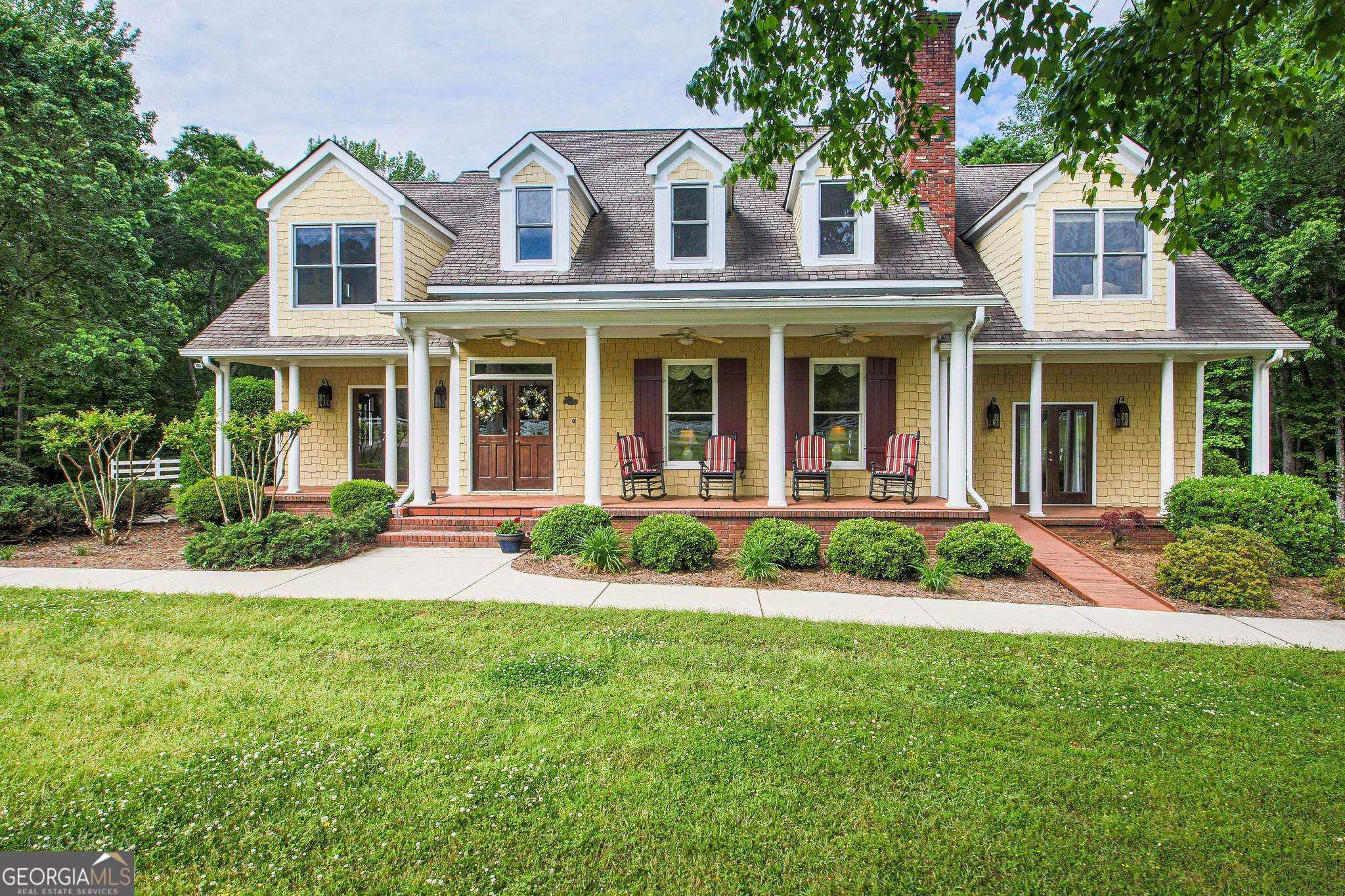 410 Mann Road Tyrone, GA 30290 - Photo 1 of 1 front view of a house with a yard