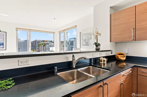 a kitchen with a sink and a window