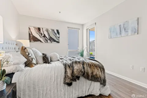 a bedroom with two beds and a night stand