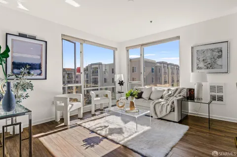 a living room with furniture and a table