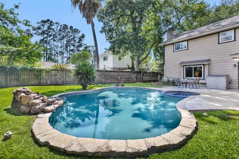 a view of a swimming pool with a sitting area