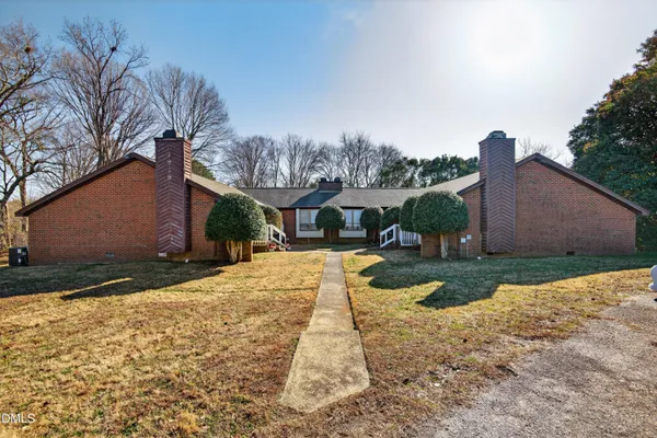 a view of a backyard with sitting area