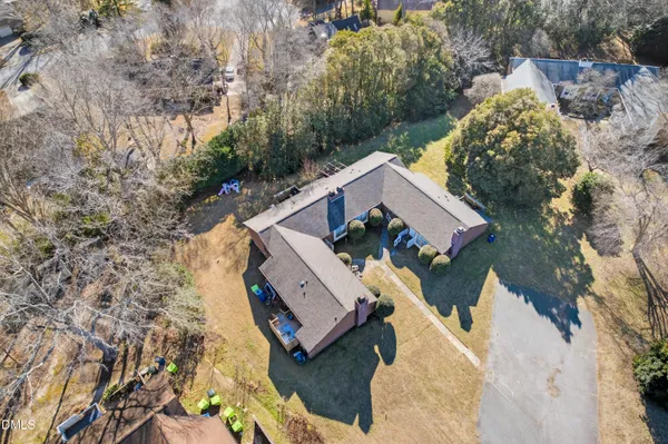 an aerial view of a house with outdoor space