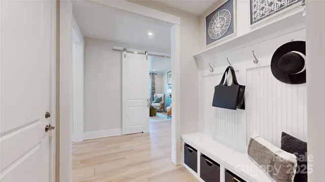 a view of a hallway with paintings on the wall