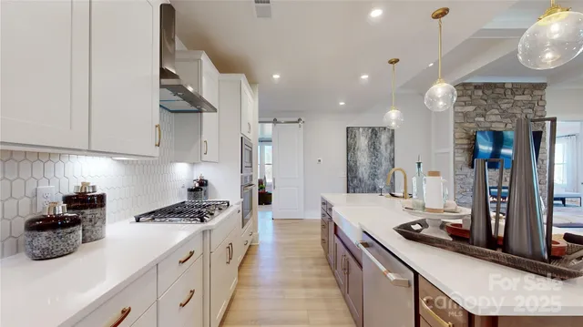 a kitchen with a sink stove and refrigerator