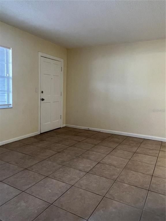 2176 Winchester Road North, Unit 2 St. Petersburg, FL 33710 - Photo 2 of 9 a view of a livingroom and entryway