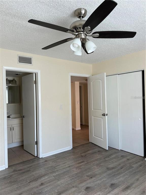 2176 Winchester Road North, Unit 2 St. Petersburg, FL 33710 - Photo 6 of 9 a view of an empty room and wooden floor