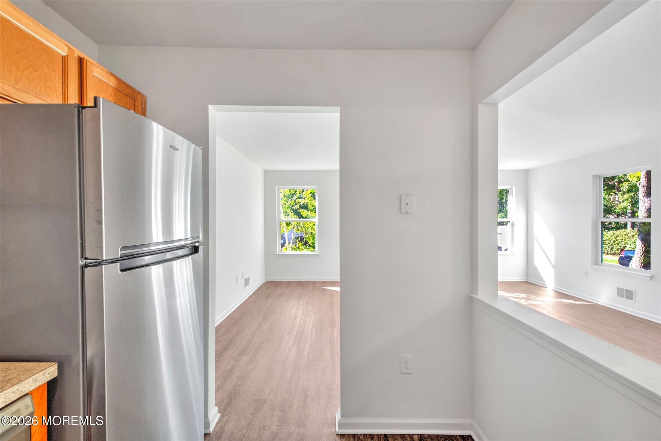 6 Esplanade Way Bayville, NJ 08721 - Photo 18 of 41 a view of an empty room with window and wooden floor