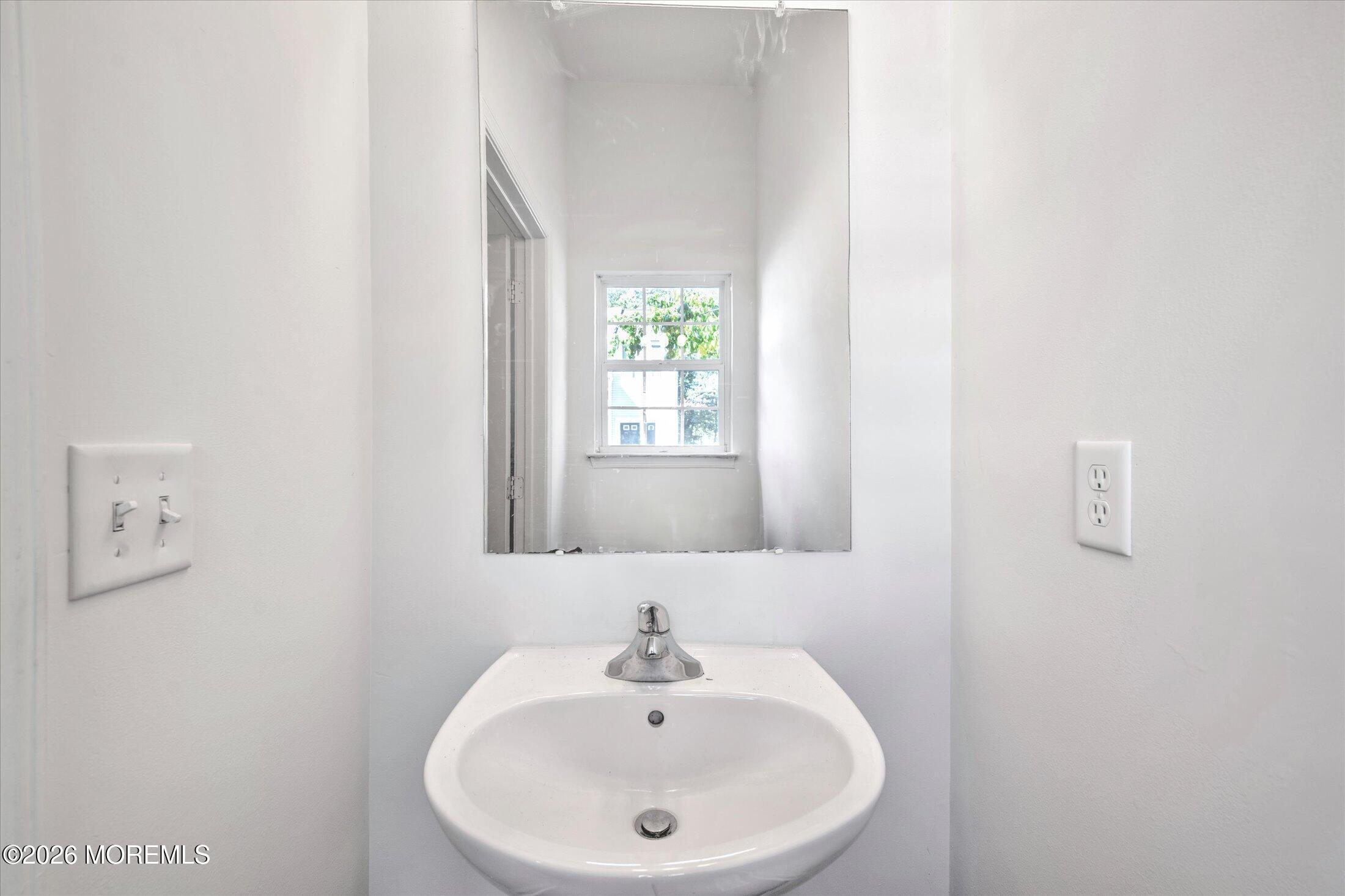 6 Esplanade Way Bayville, NJ 08721 - Photo 20 of 41 a bathroom with a sink and a mirror