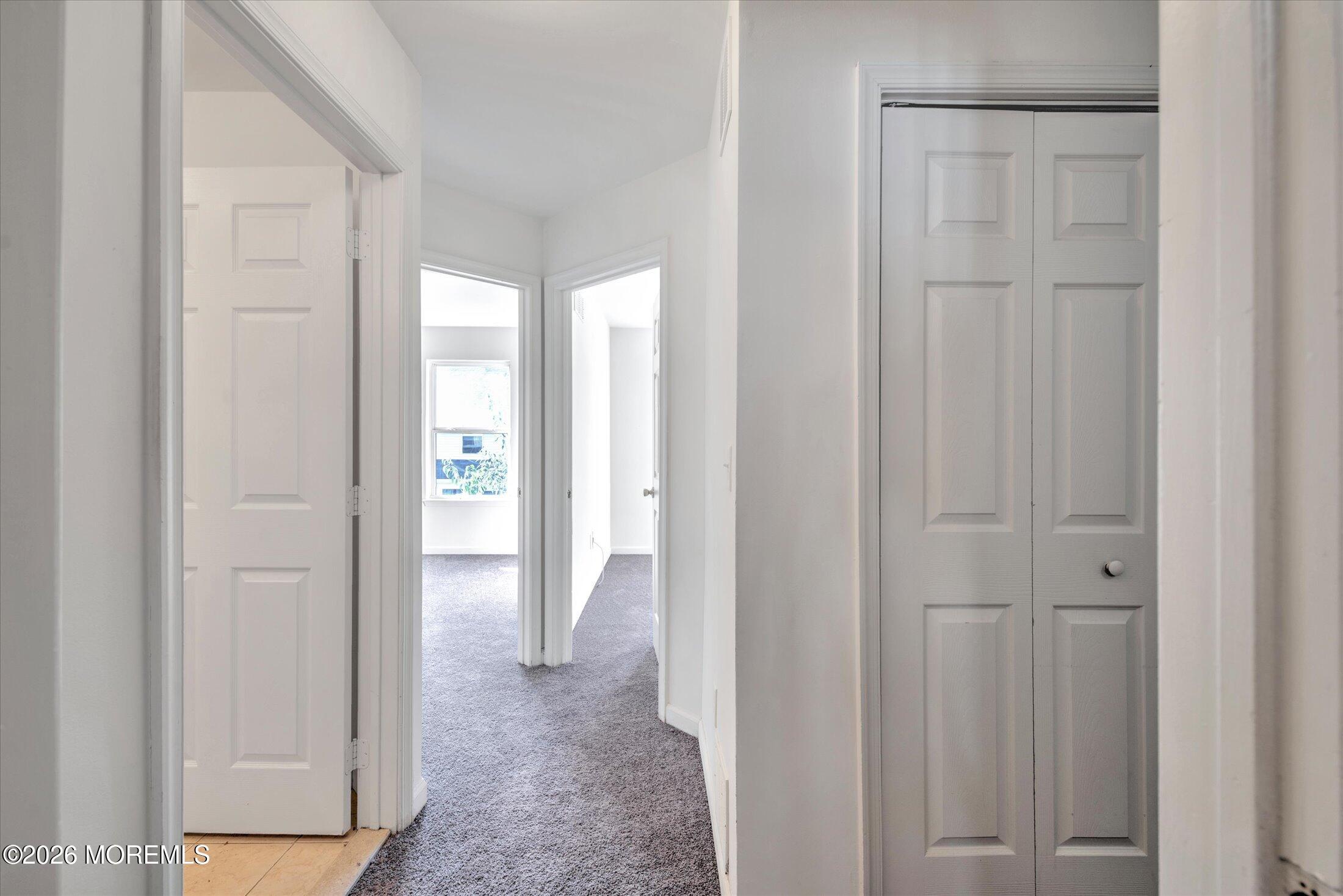 6 Esplanade Way Bayville, NJ 08721 - Photo 21 of 41 a view of a livingroom from a hallway
