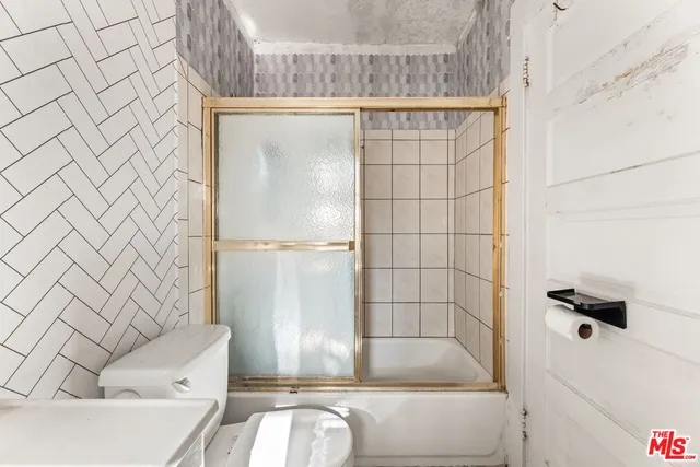 a kitchen with a stove and a sink