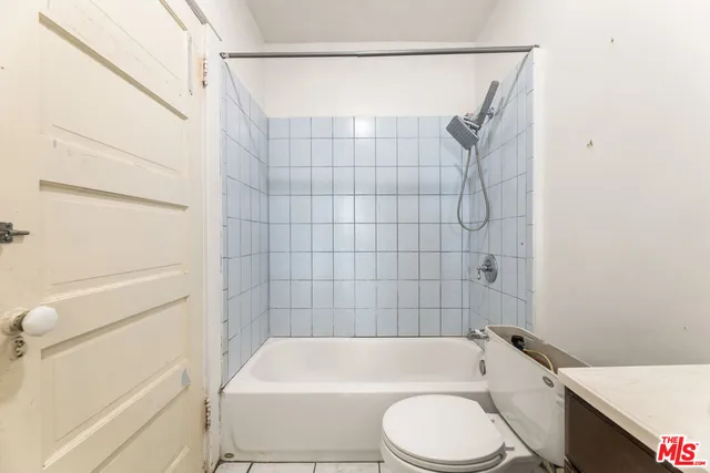 a view of a kitchen with a sink and a window