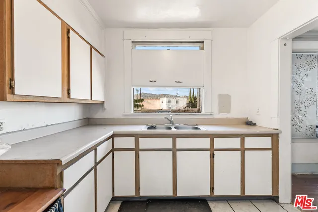 a view of a livingroom with furniture and wooden floor