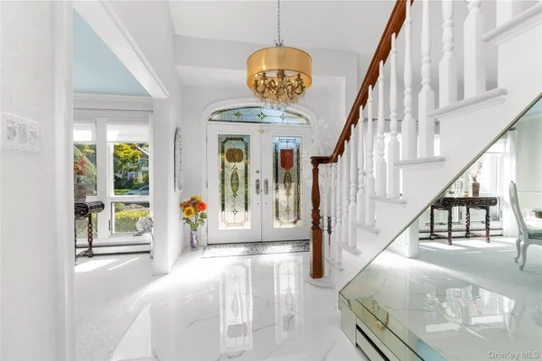 a view of hall way with staircase