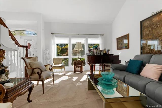 a bedroom with a bed a tv and a couch