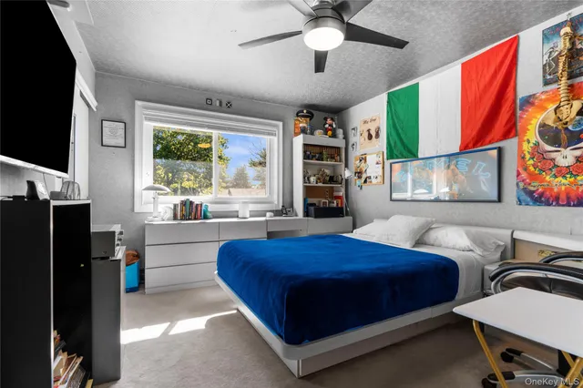 a bedroom with a bed and a table in it