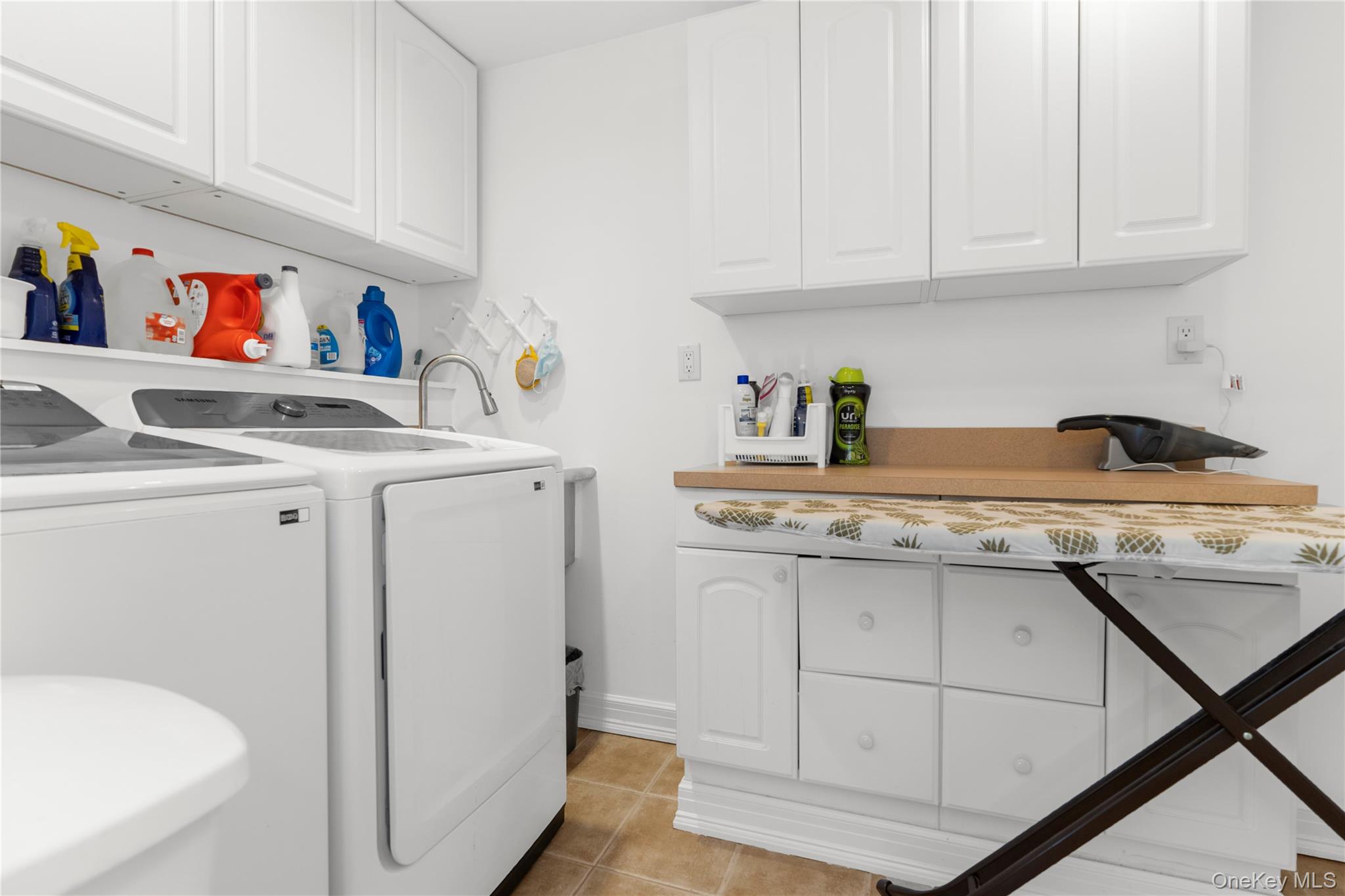 28 Annandale Road Commack, NY 11725 - Photo 24 of 29 a kitchen with a sink a stove and cabinets