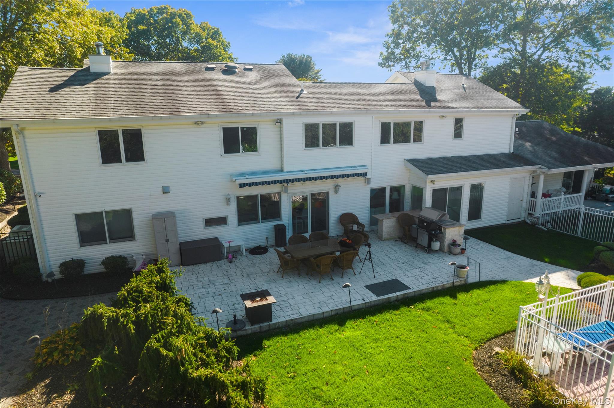 28 Annandale Road Commack, NY 11725 - Photo 26 of 29 a front view of house with yard and outdoor seating
