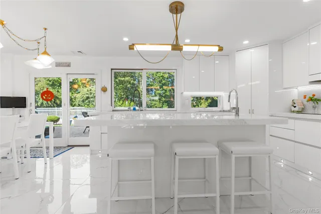 a kitchen with a sink cabinets and window