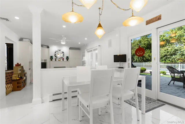 a living room with furniture fireplace and a large window