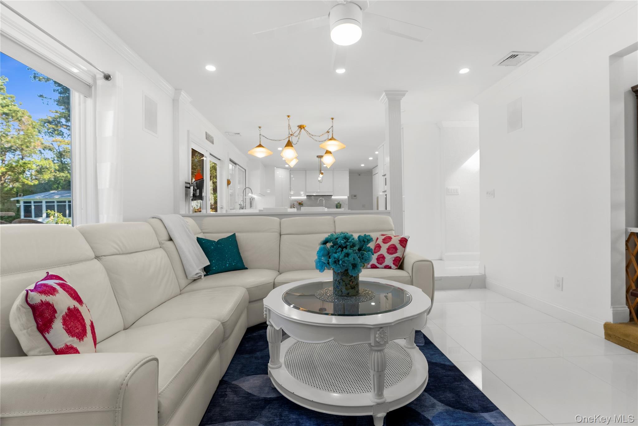 28 Annandale Road Commack, NY 11725 - Photo 9 of 29 a living room with furniture and a chandelier