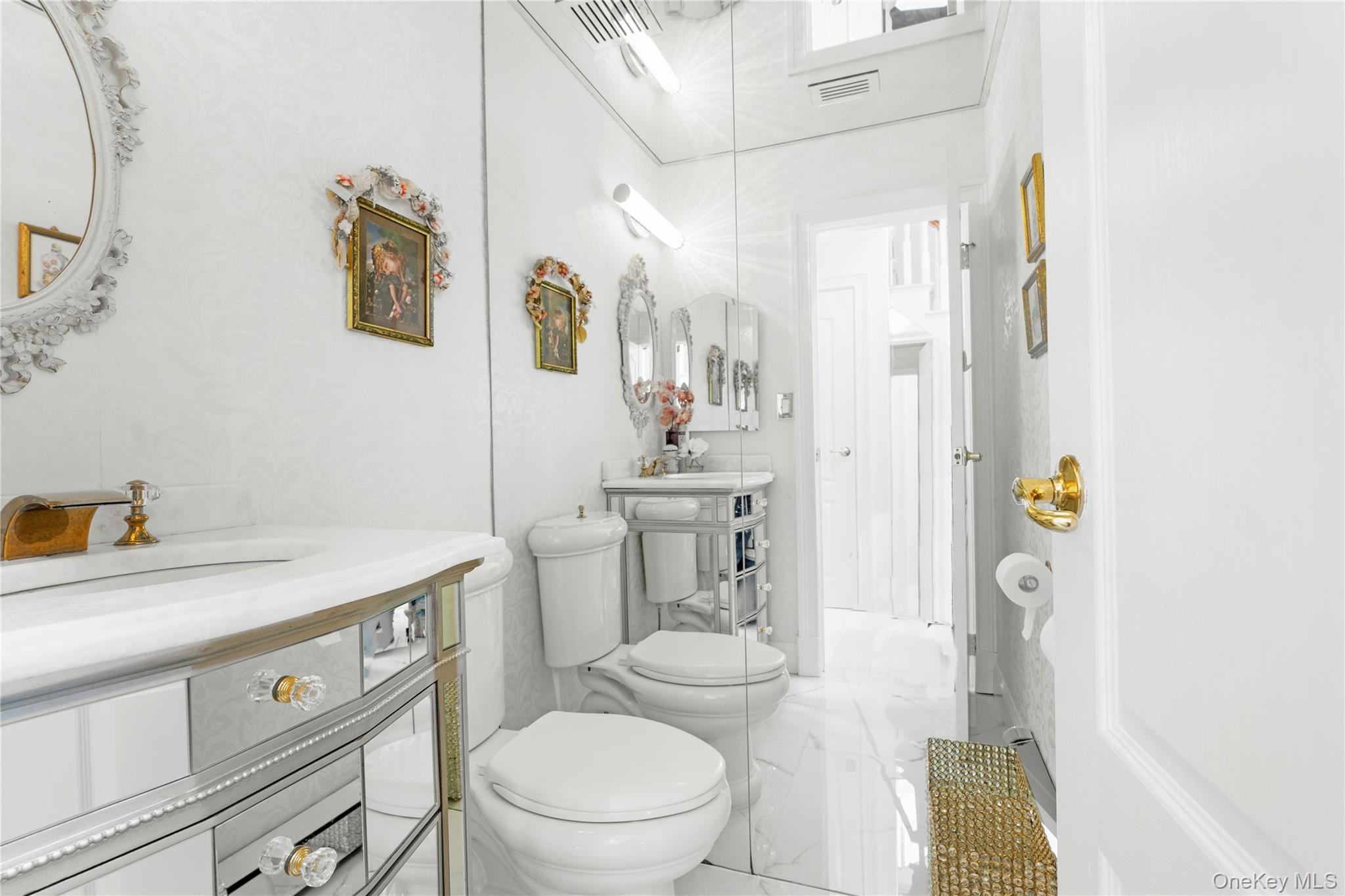 28 Annandale Road Commack, NY 11725 - Photo 10 of 29 a bathroom with a granite countertop toilet sink and mirror