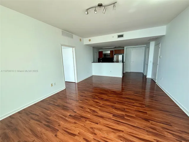 a bathroom with a shower a toilet and a shower