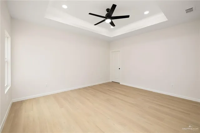 a bathroom with a sink vanity granite and a mirror