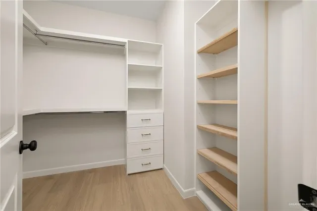 an aerial view of a house with a garden and pool
