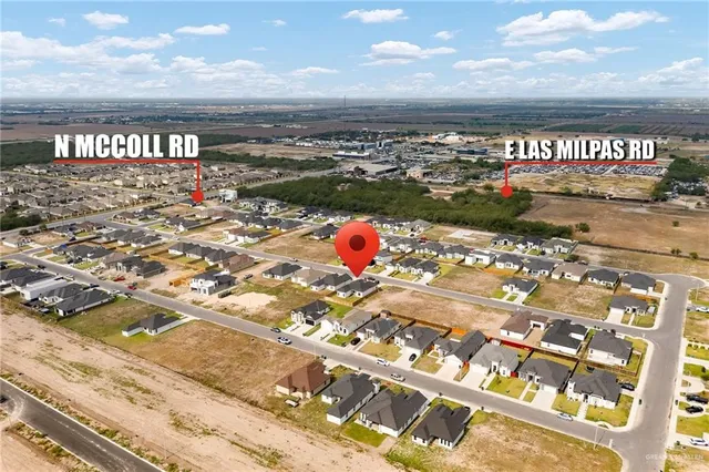 a view of a wooden floor in front of a bathroom