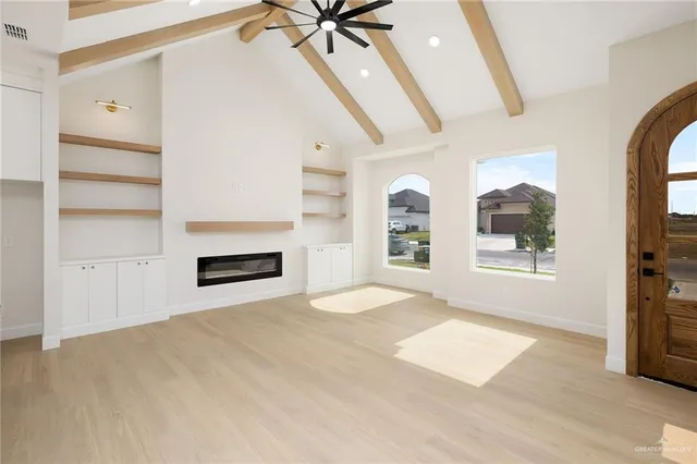 a view of a kitchen with furniture and a ceiling fan