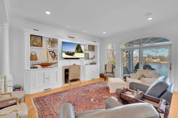 a bathroom with a sink a toilet and a large mirror