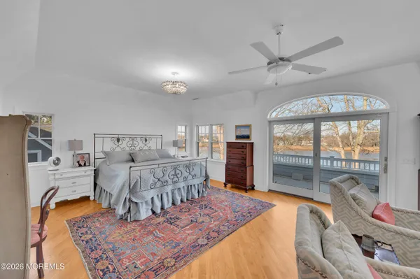 a bedroom with a bed and a table in it