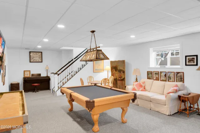 an aerial view of a house with a yard and garden