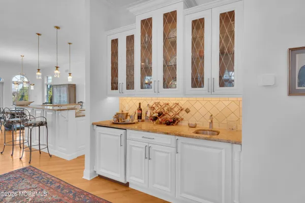 a bathroom with a sink vanity mirror and toilet