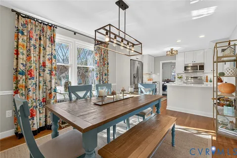 a kitchen with sink cabinets and dining table