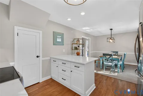 a kitchen with stainless steel appliances a sink stove and refrigerator